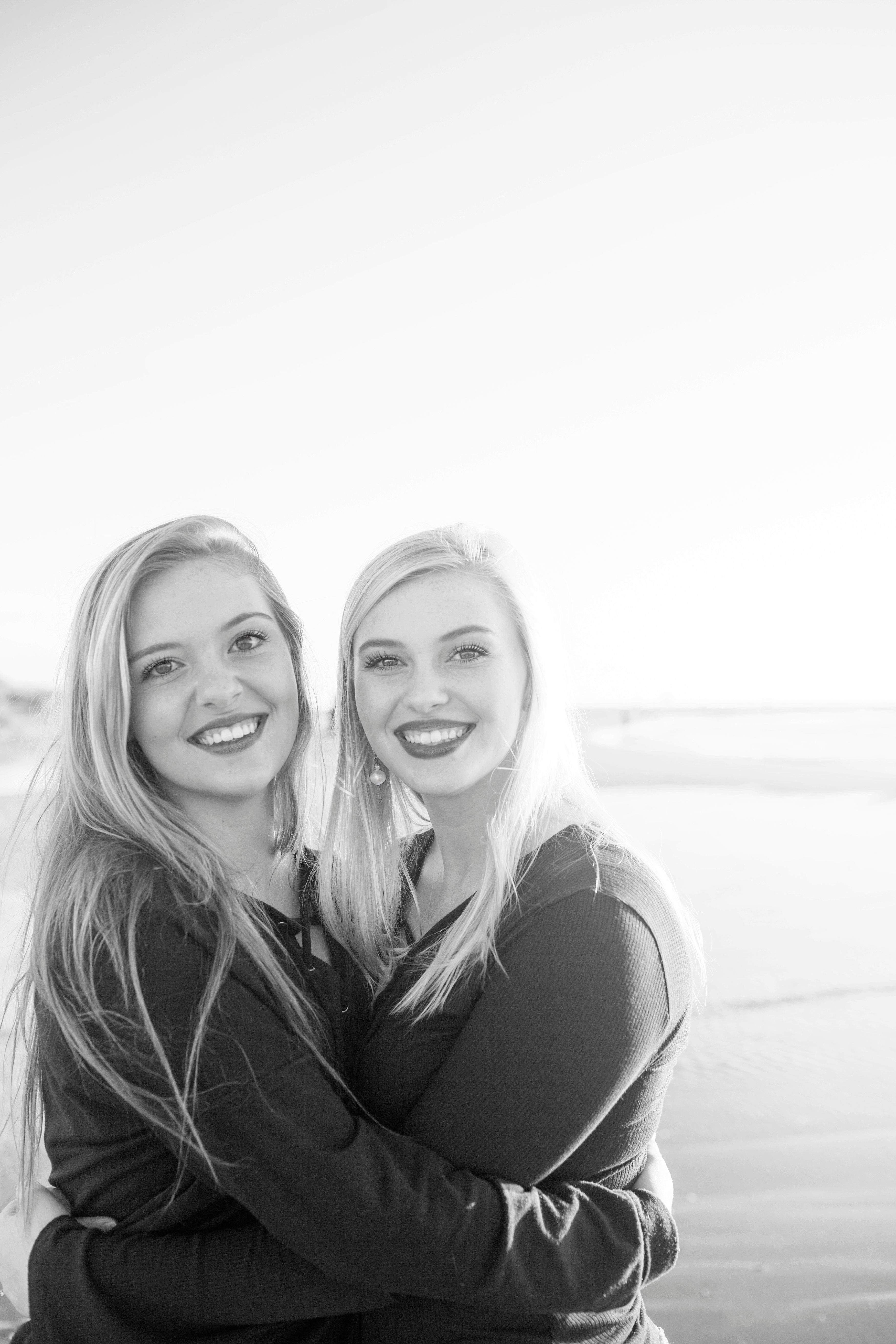 black and white portrait of sisters at the beach in wilmington,nc 
